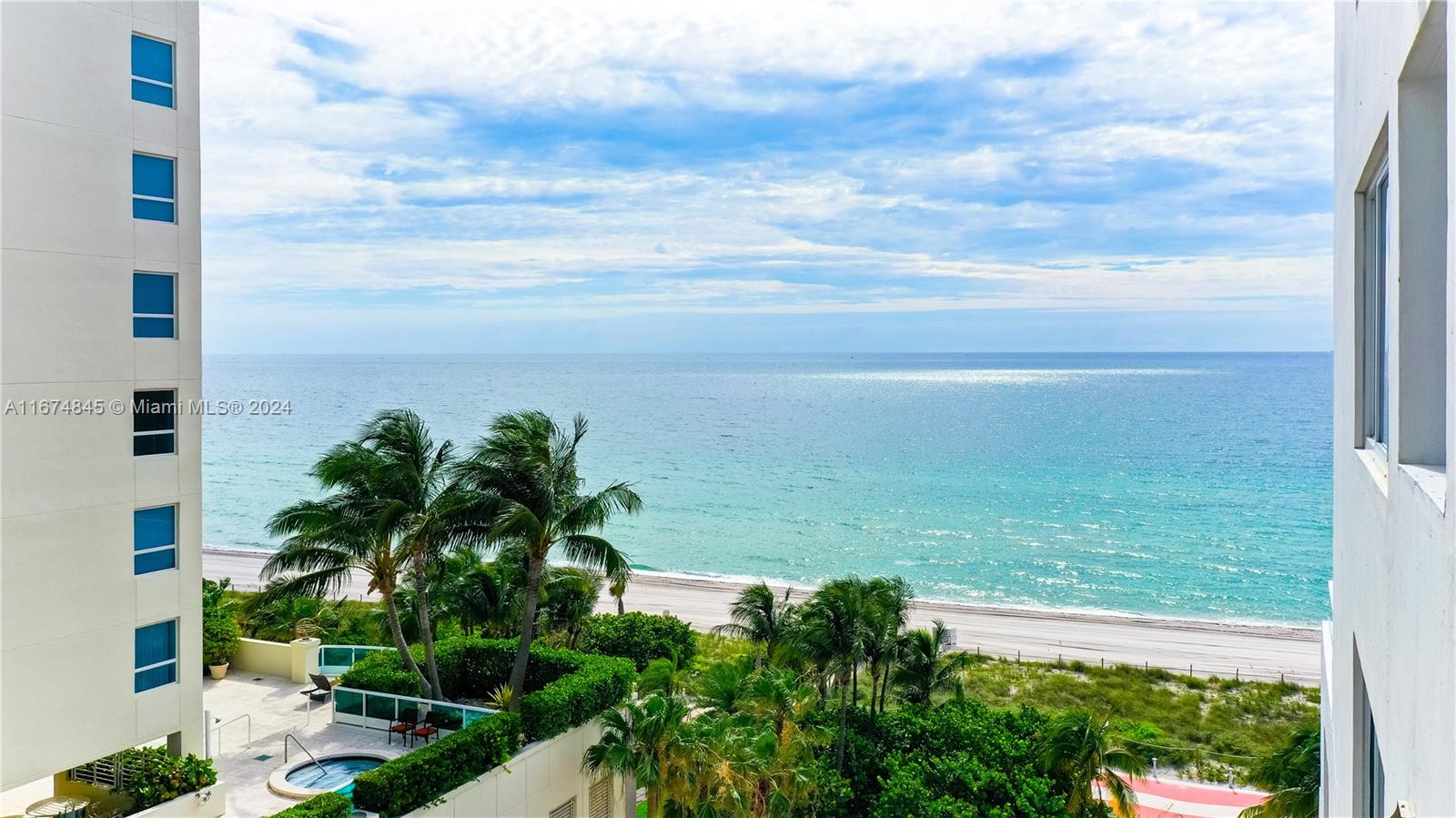 a view of a yard with an ocean view