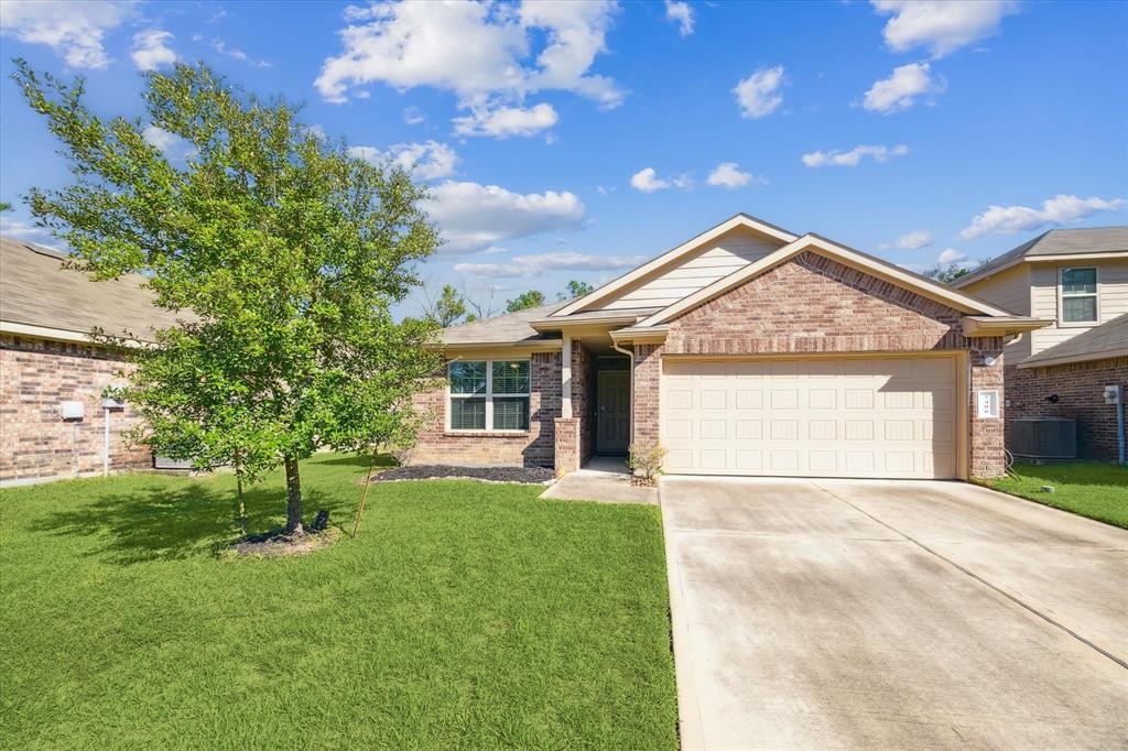 This charming 3/2 brick home features a decorative siding accent that adds contrast and character. A large front yard completes the inviting curb appeal.