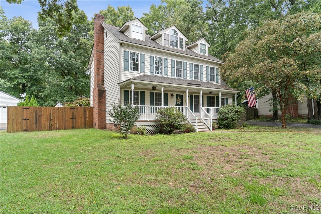 View of front of house featuring a porch and a fro