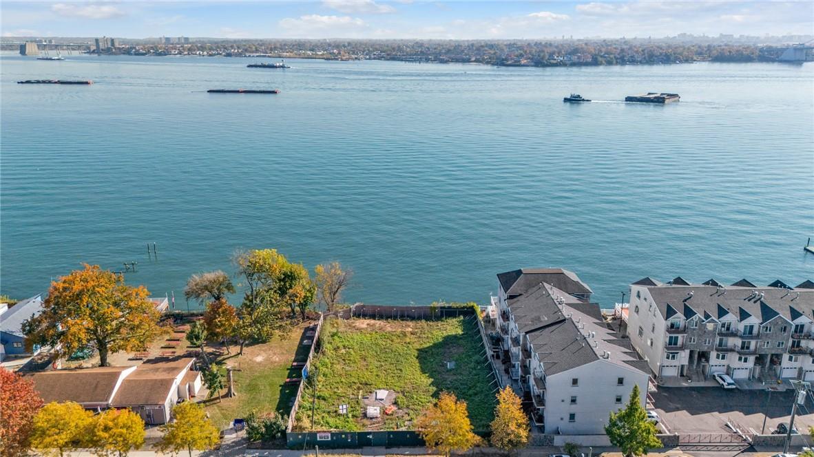 an aerial view of a house with a lake view