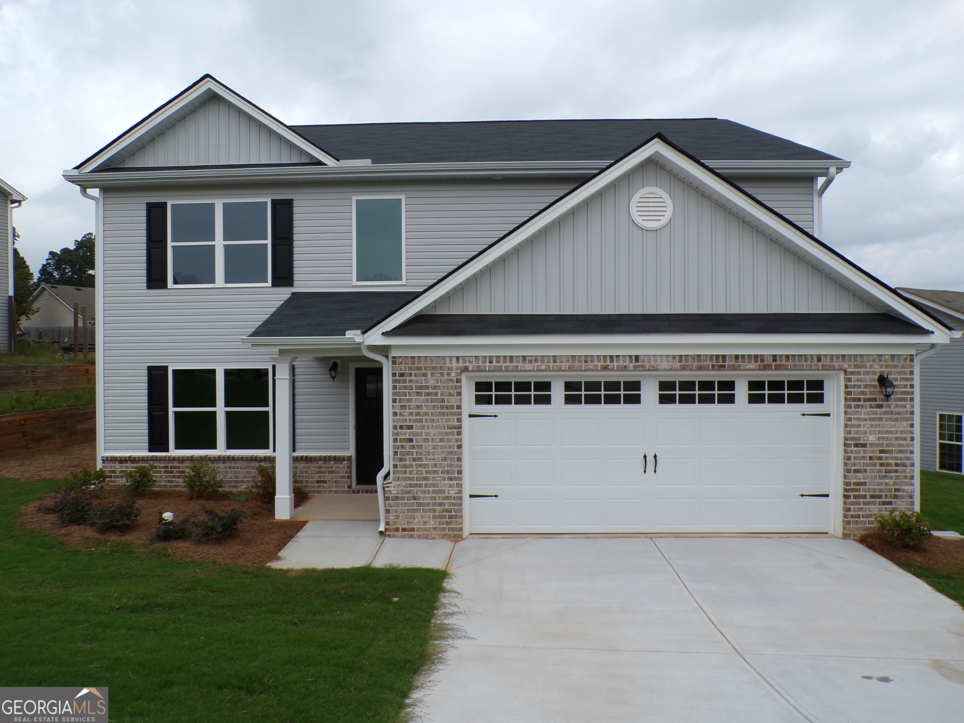 a front view of a house with a yard