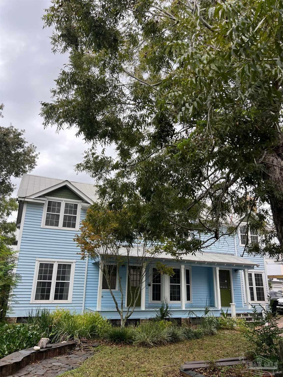 front view of a house with a yard