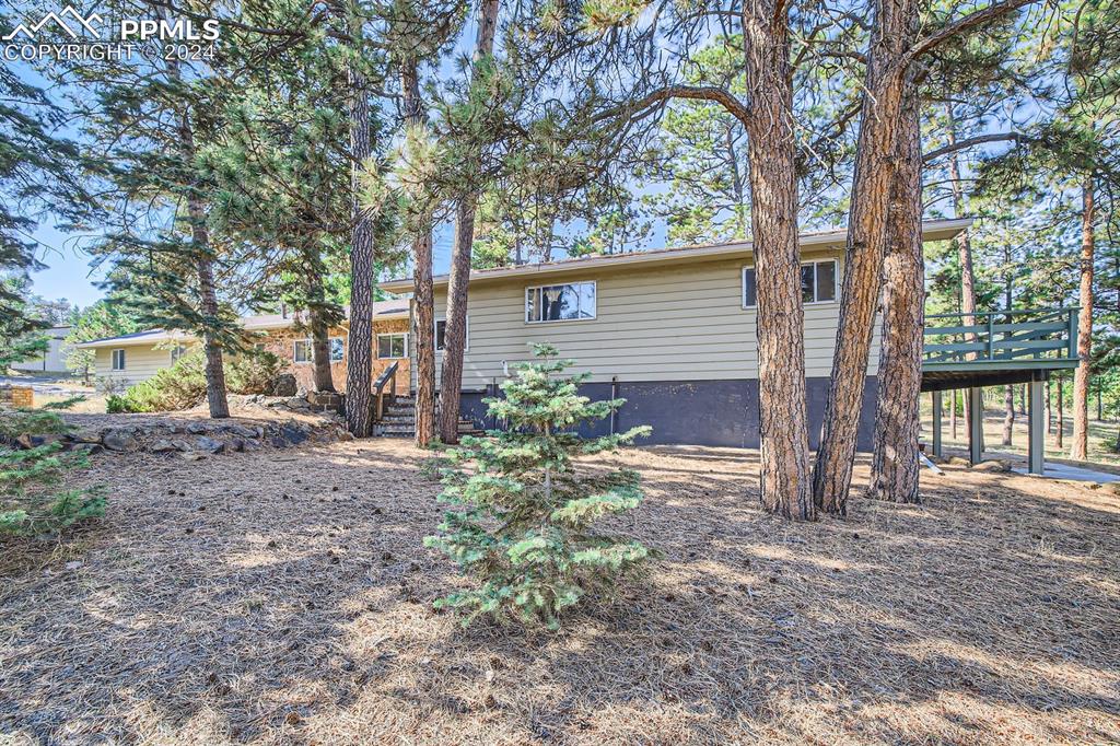 Front view of property featuring a deck