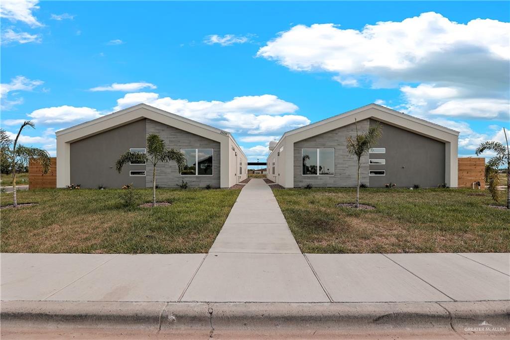 a view of house with yard