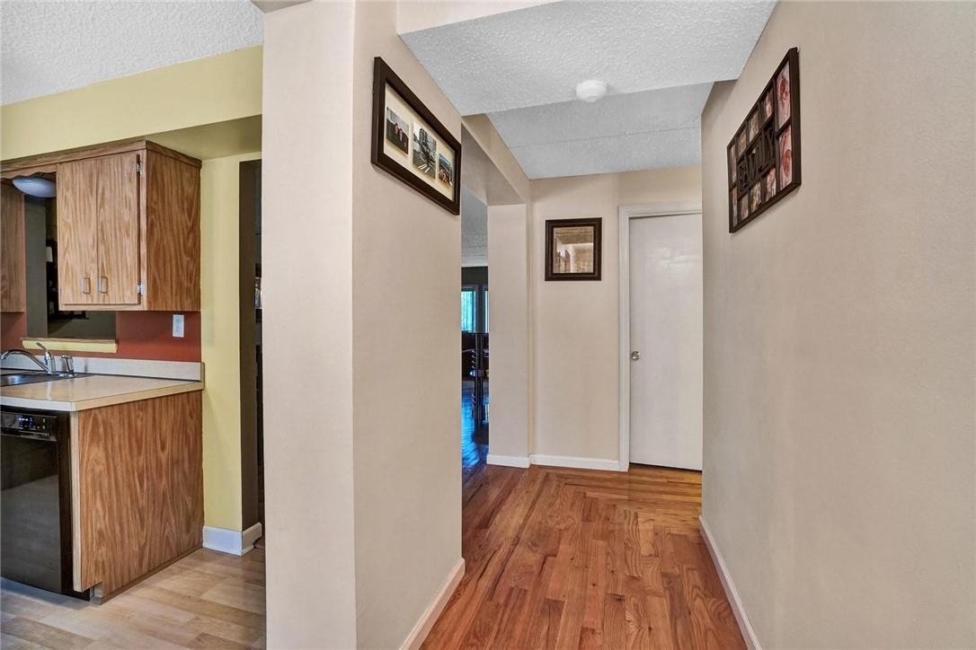 a view of a kitchen from the hallway