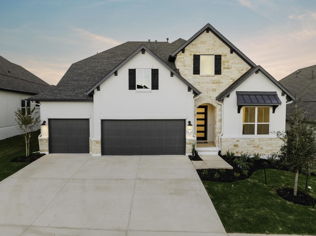 a front view of a house with a yard