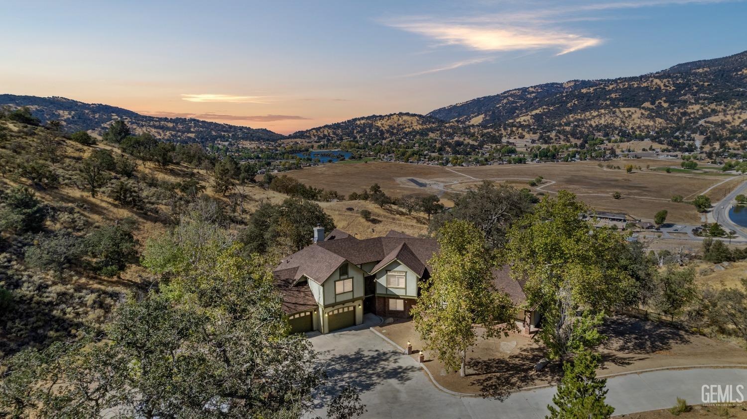 an aerial view of a house with mountain view