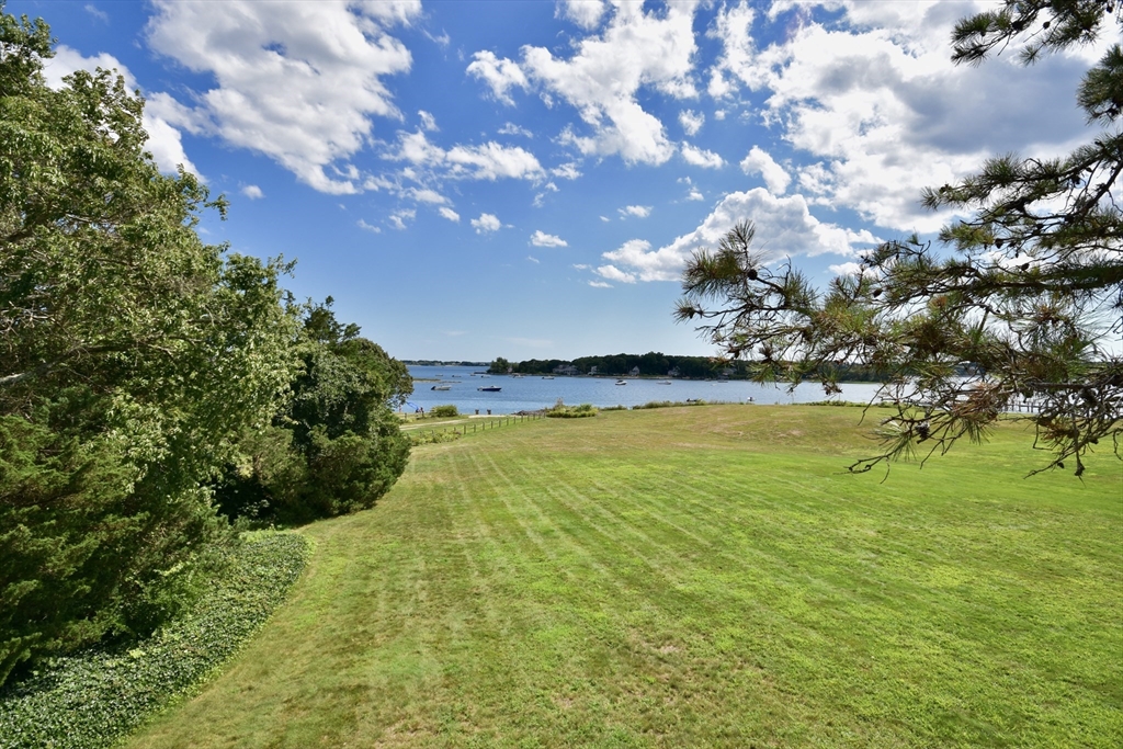 a view of an ocean and a yard