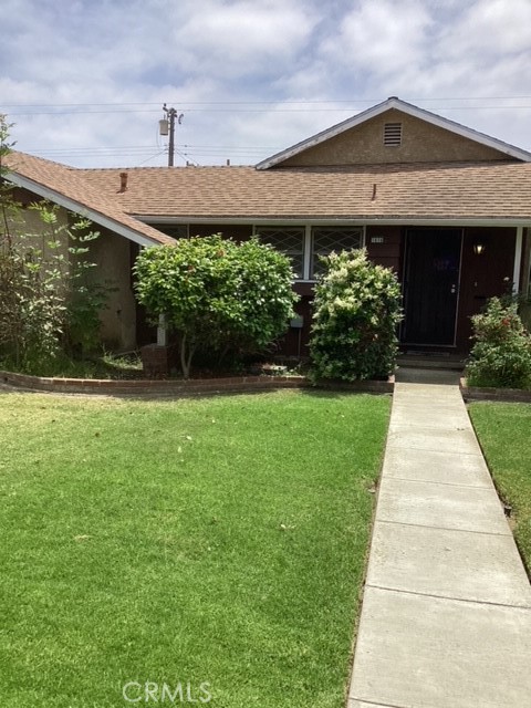 a front view of house with garden