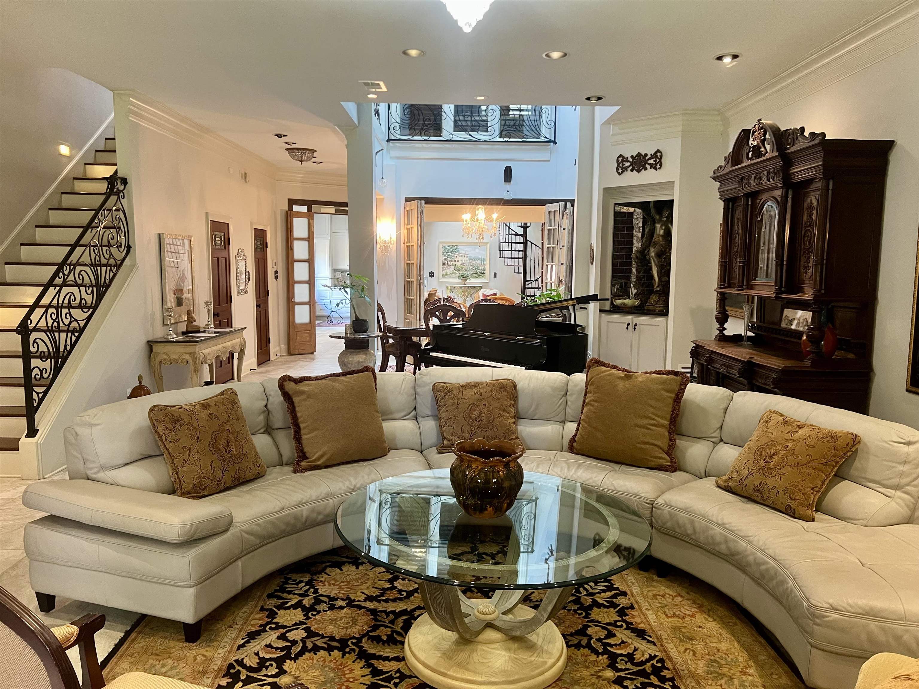 a living room with furniture ceiling fan and a rug