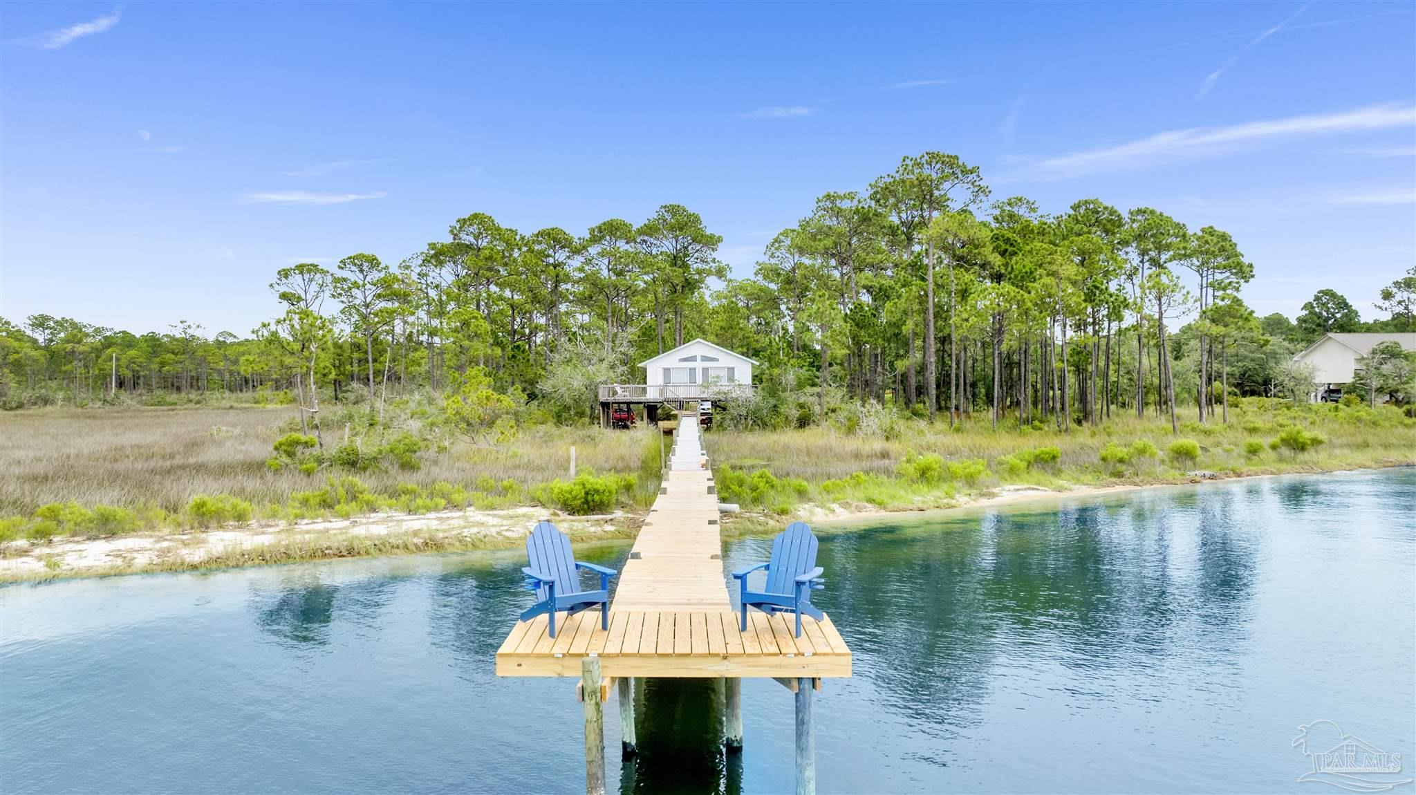 a view of a lake with a yard