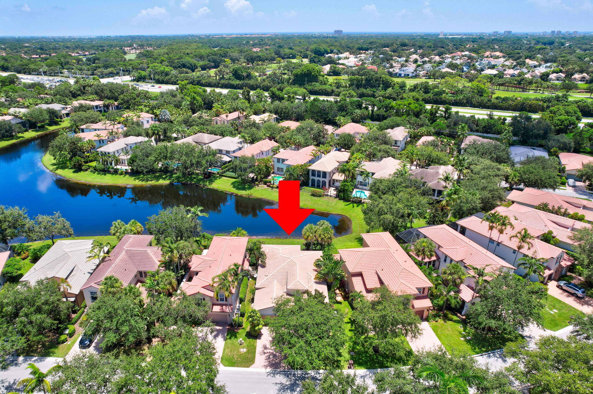 an aerial view of residential houses with outdoor space and swimming pool