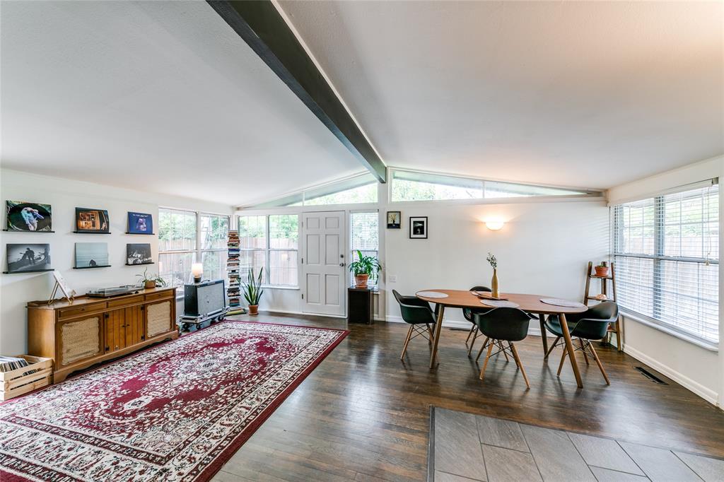 a living room with furniture a rug and a fireplace