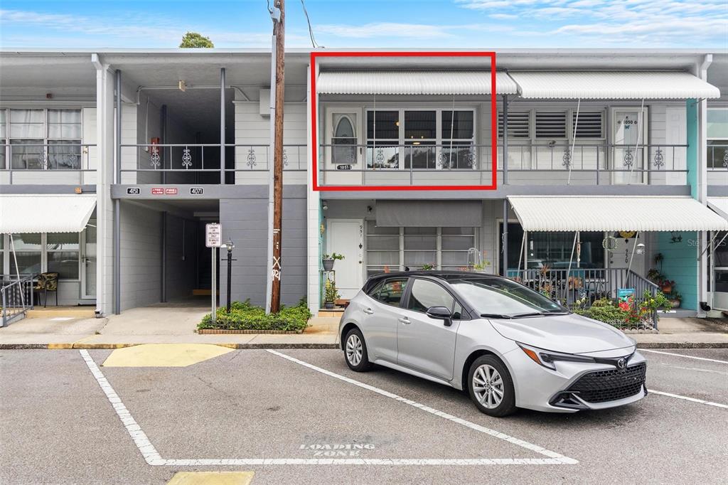 a car parked in front of a building