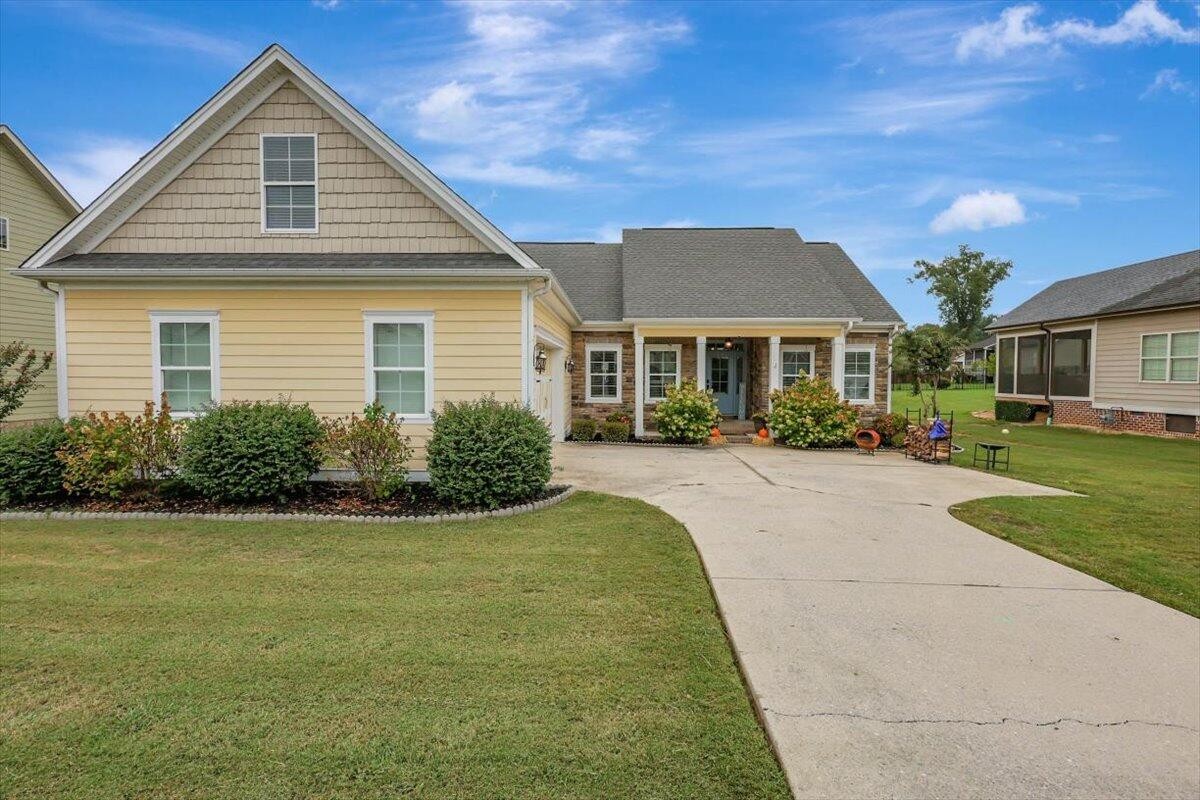 a front view of a house with a yard