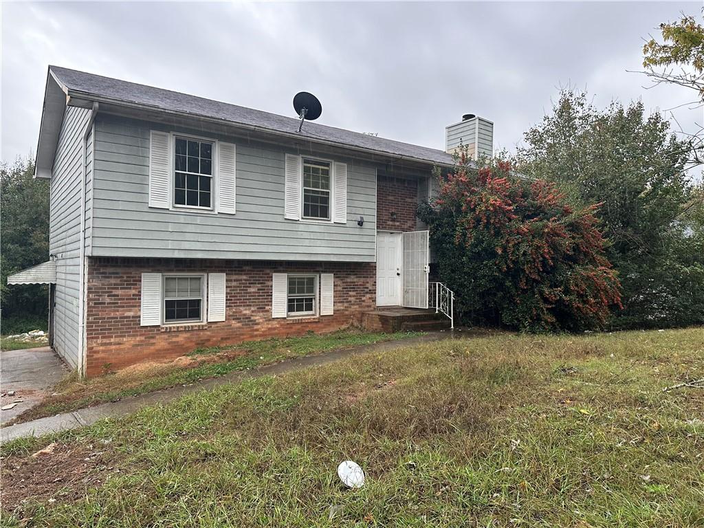 a front view of a house with yard