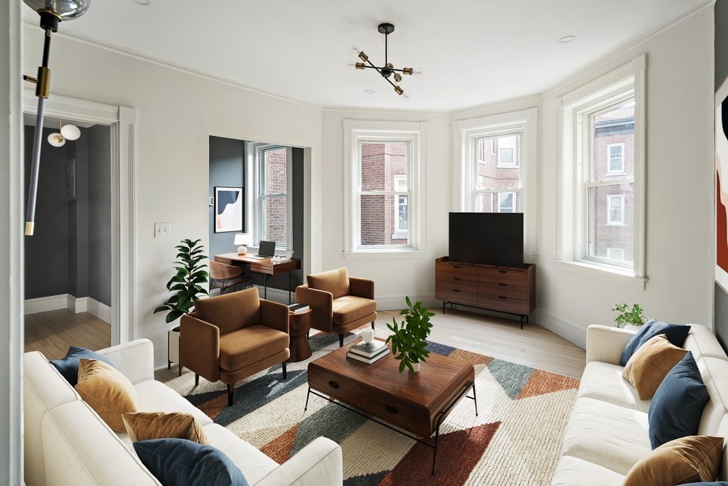 a living room with furniture and a flat screen tv