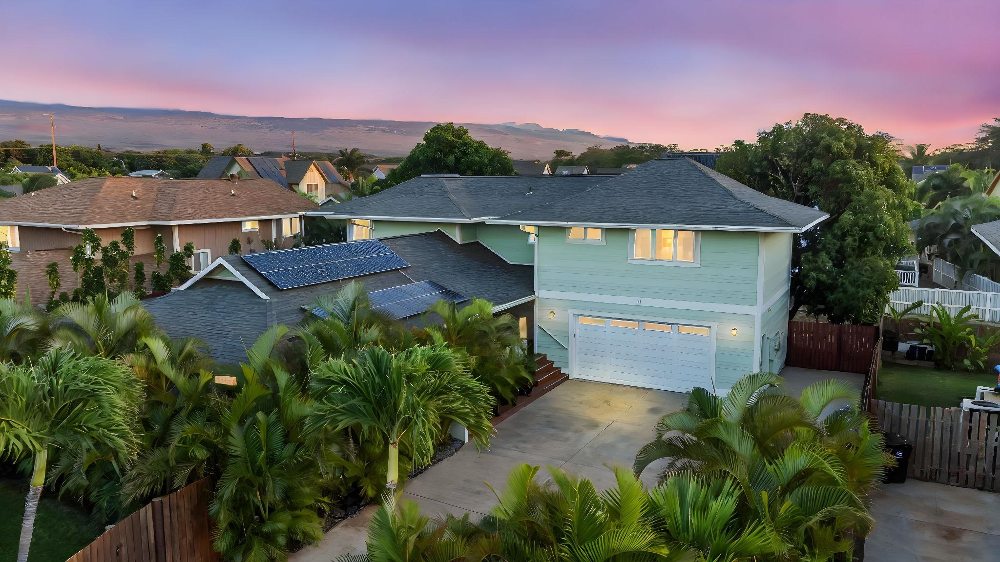 a aerial view of a house with a yard