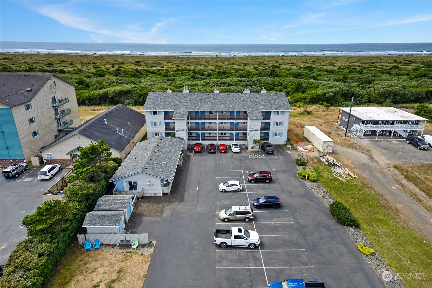 an aerial view of multiple houses with yard