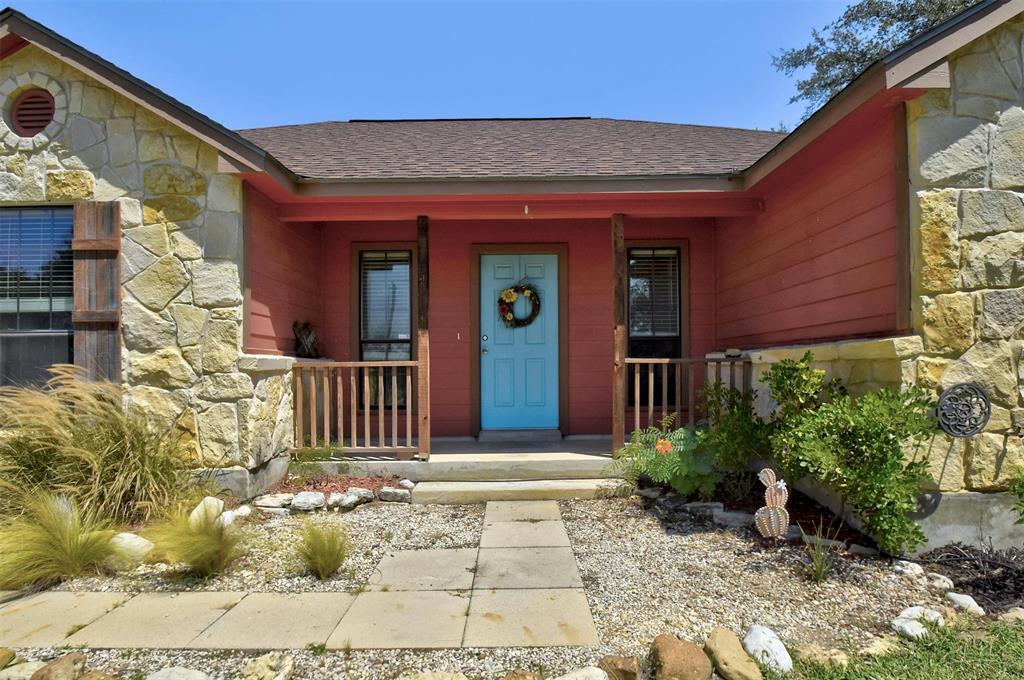 a view of a house with a small yard