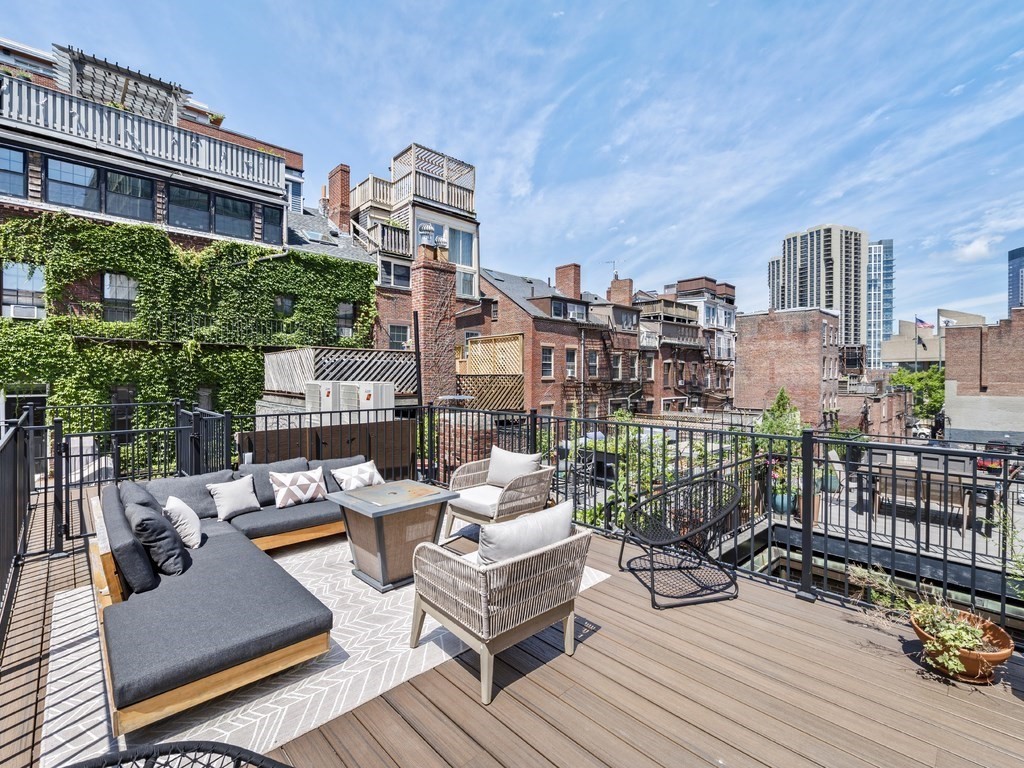 a view of a roof deck with couches