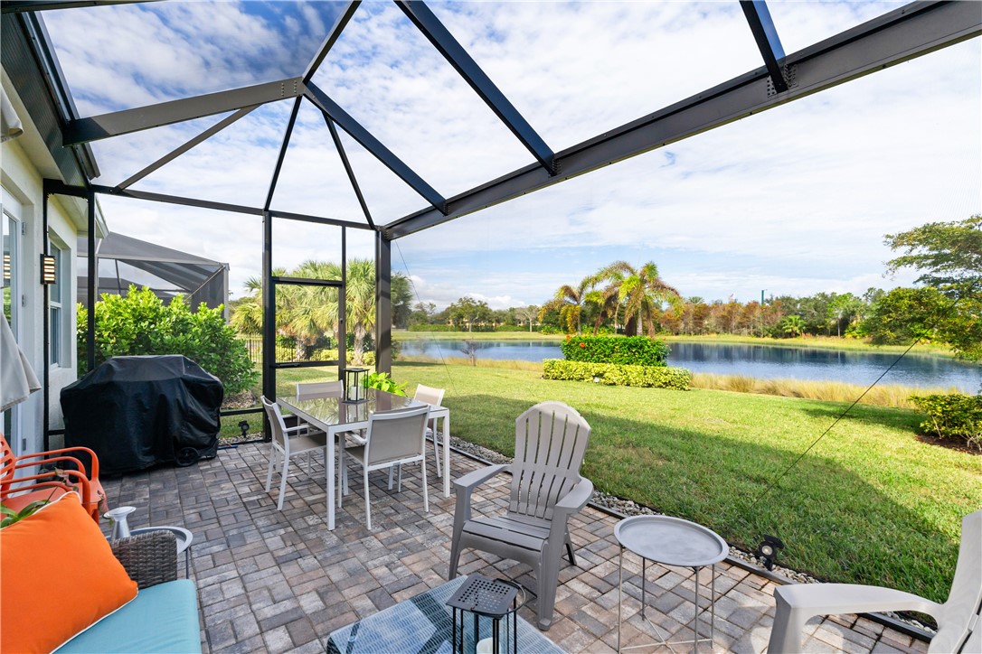 a view of an chairs and table in the patio