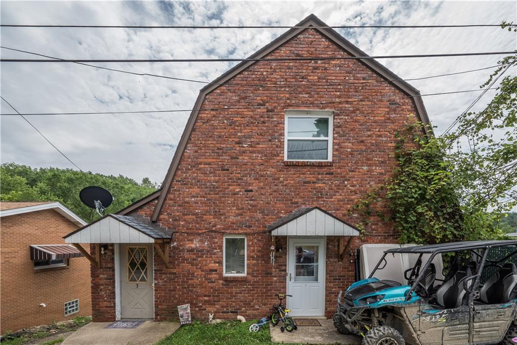 a front view of a house with yard