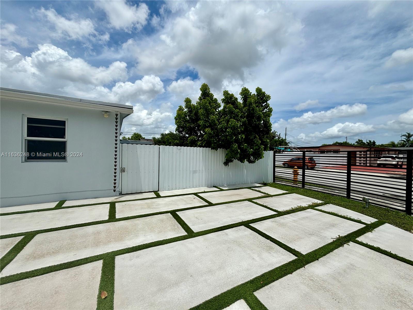 a backyard of a house with lots of green space