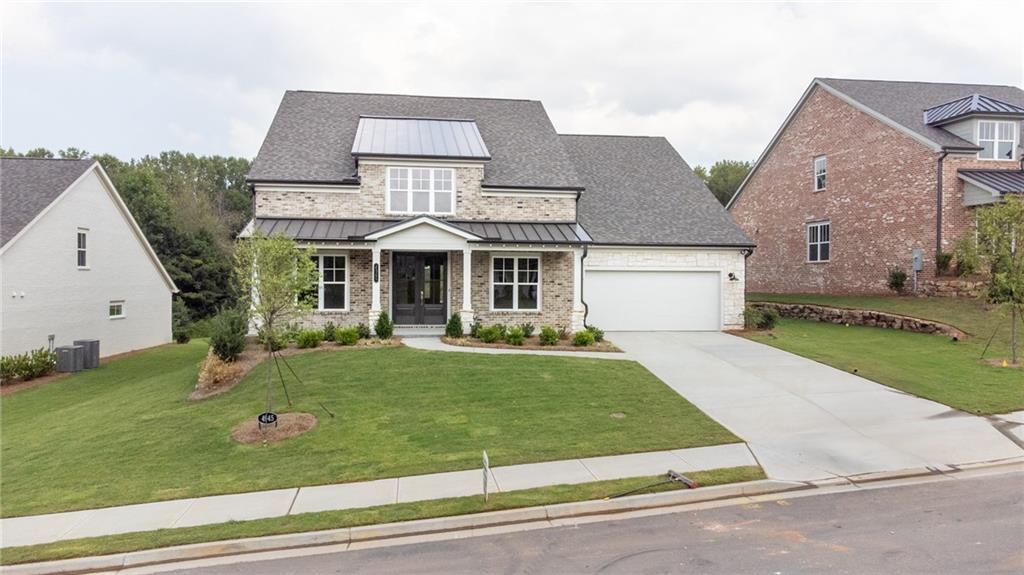 front view of a house with a yard