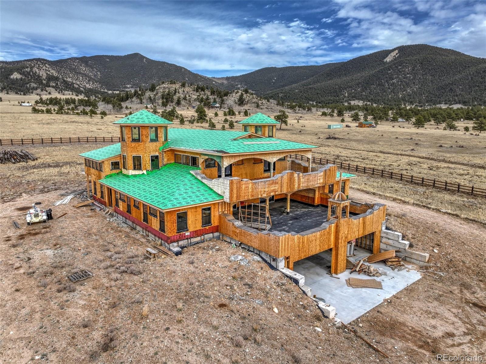 an aerial view of residential houses with outdoor space and river