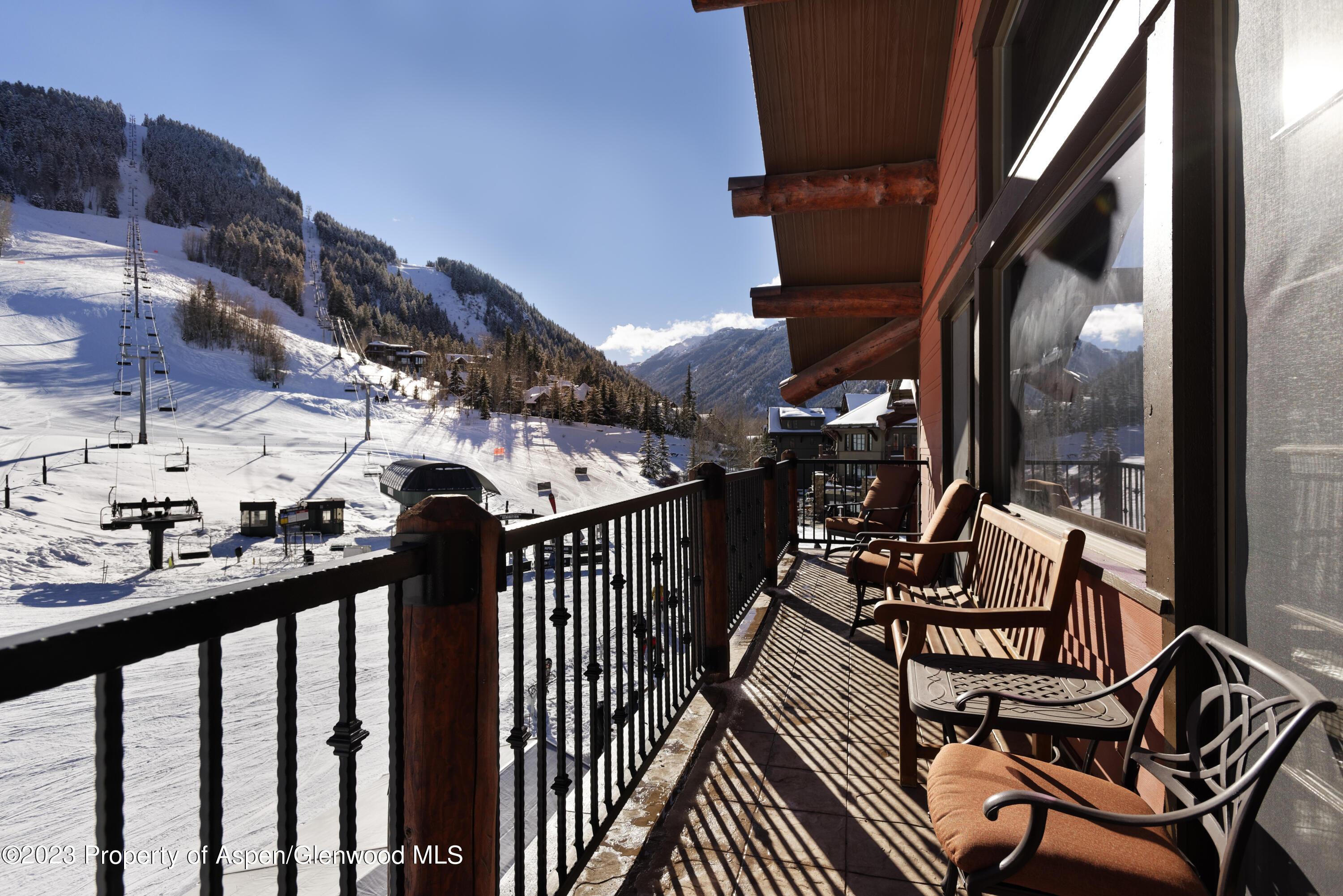 a view of chairs and deck in the balcony