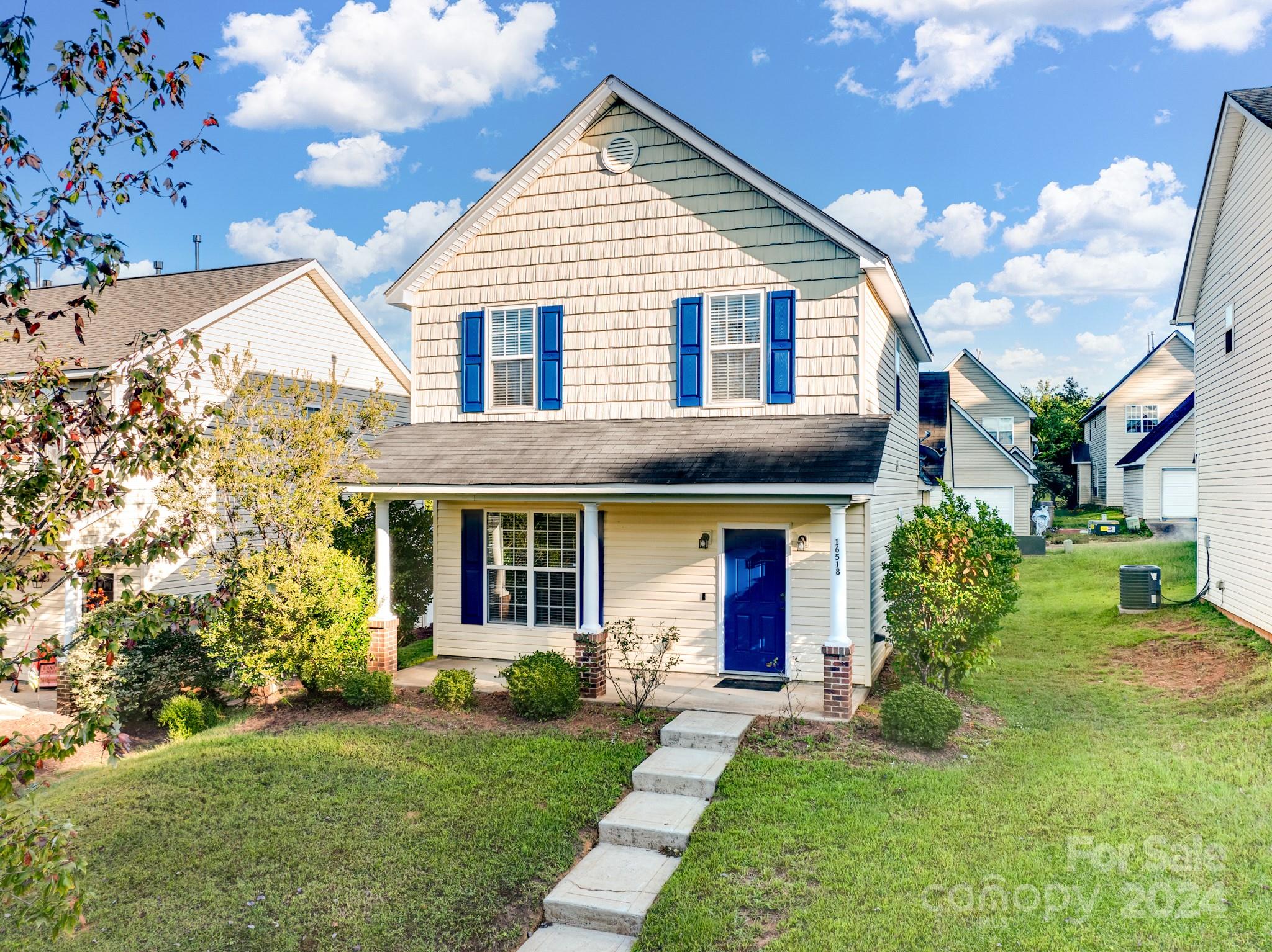 a view of a house with a yard