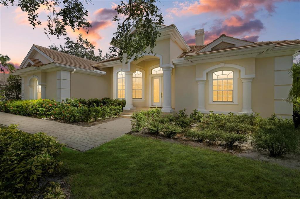 a front view of a house with garden