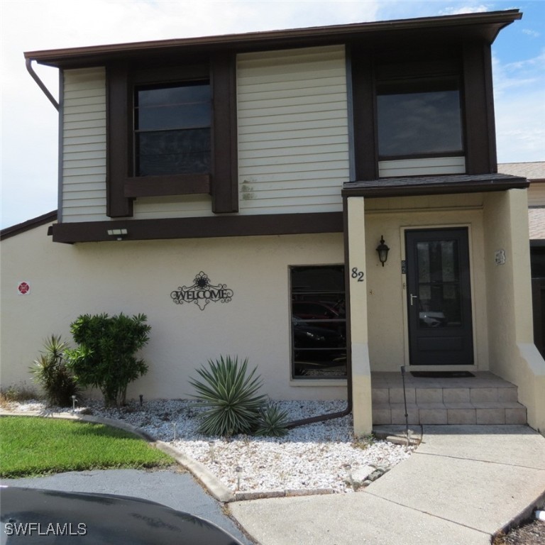 a front view of a house with garage