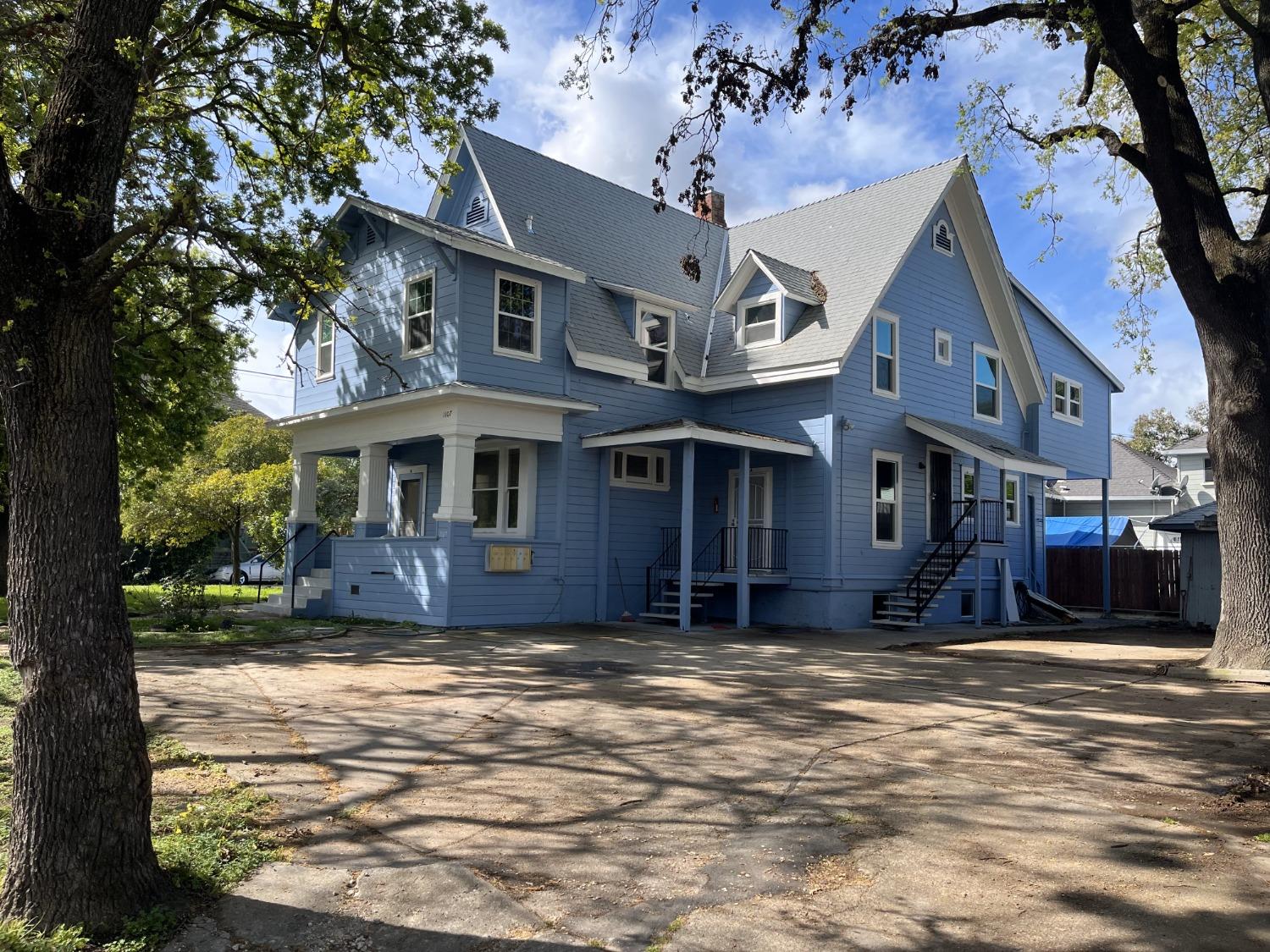 a view of a building with a yard