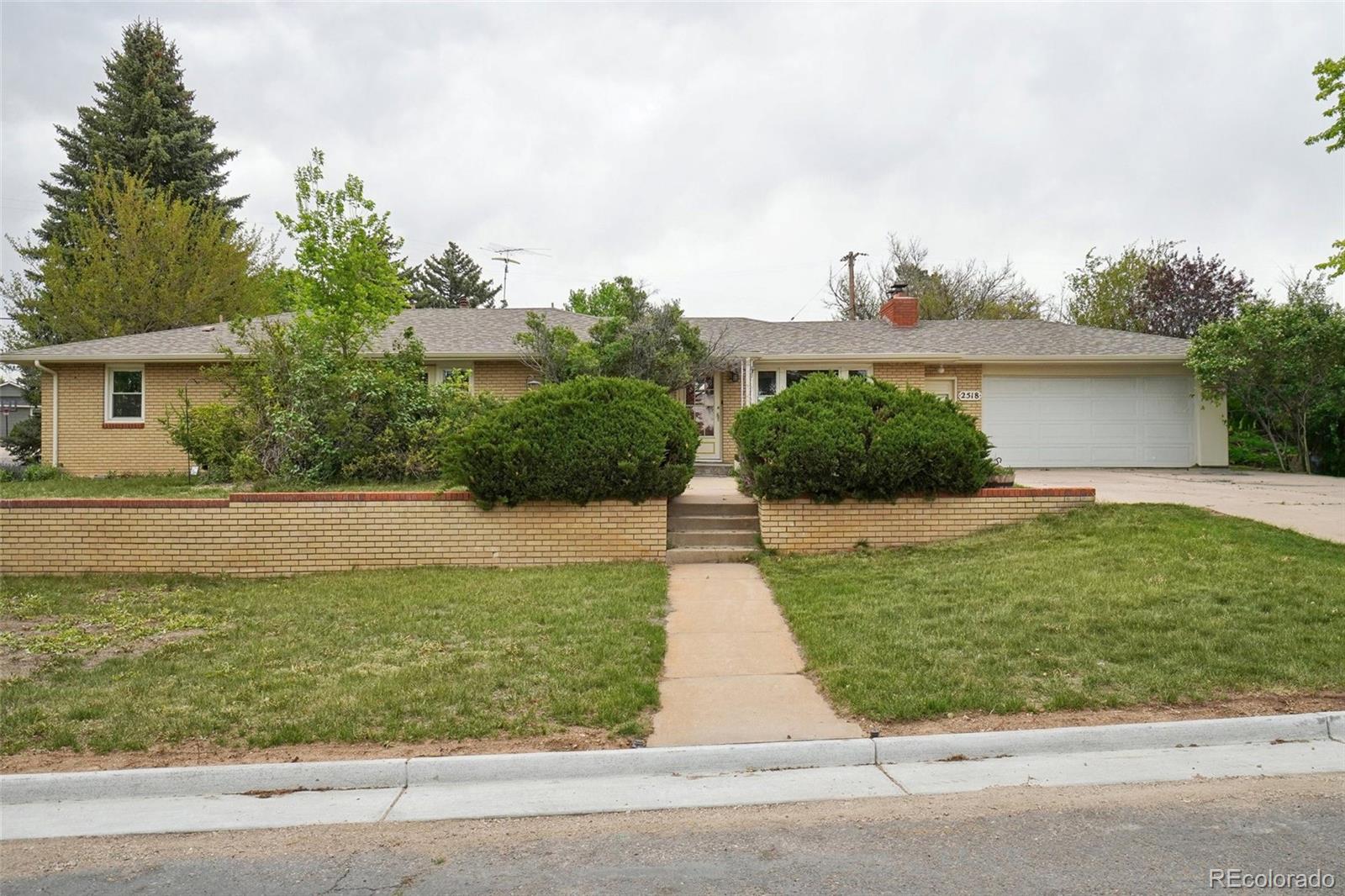 front view of a house with a yard