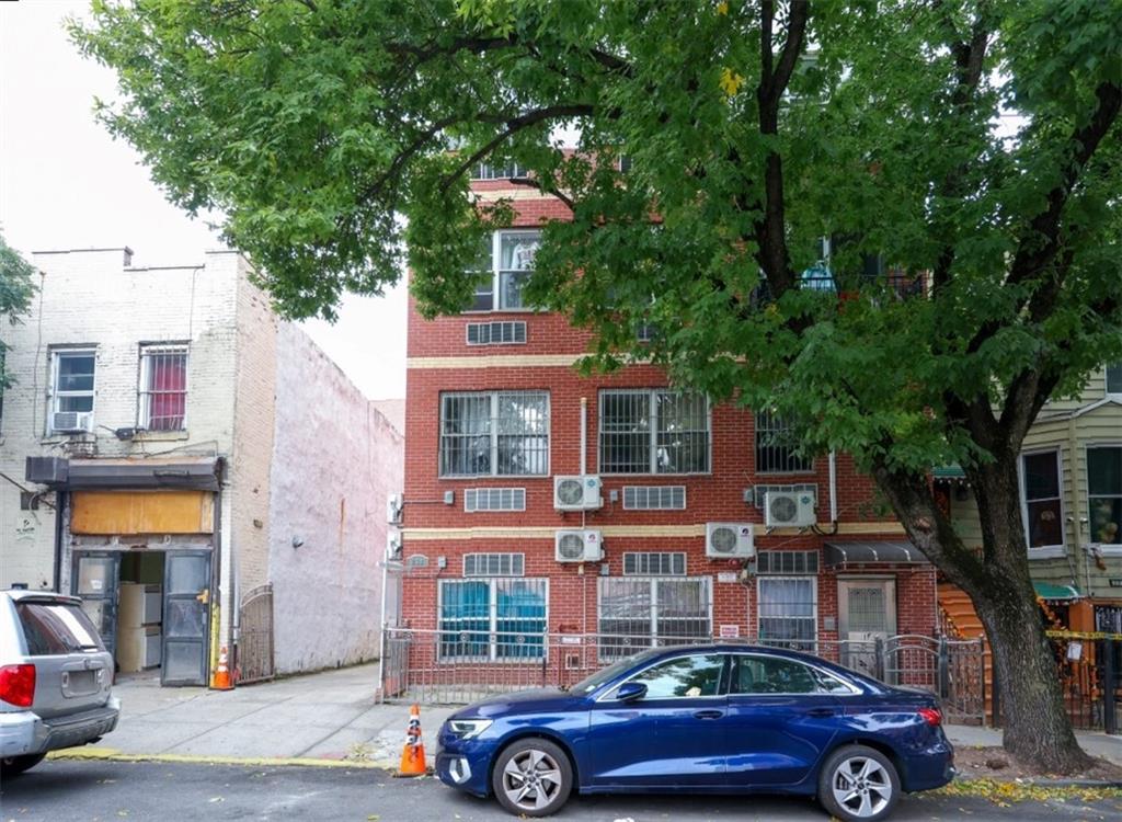 a front view of a house with parking space