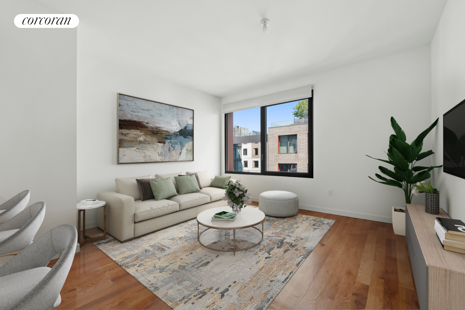 a living room with furniture and a potted plant