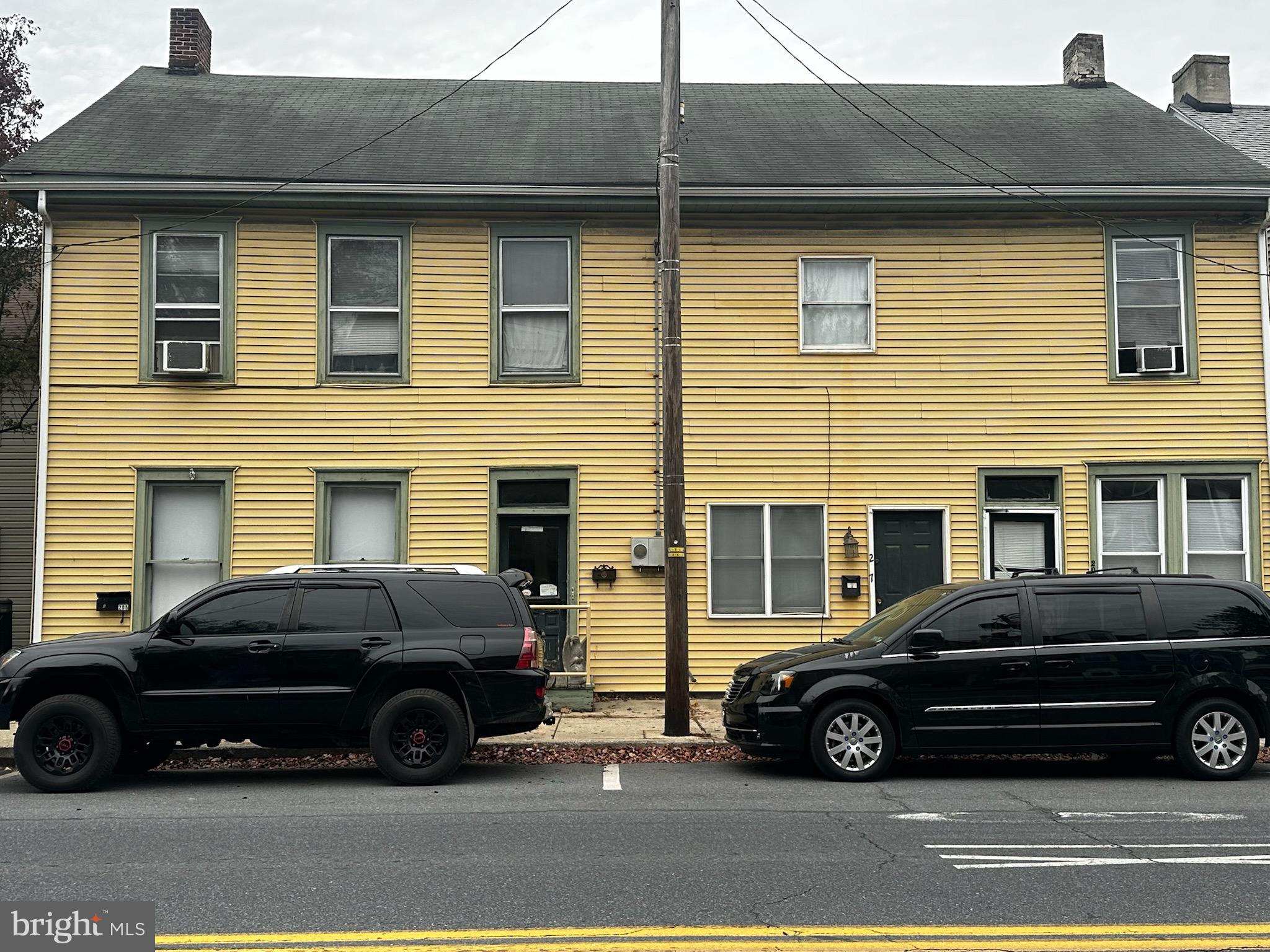 a car parked in front of a house