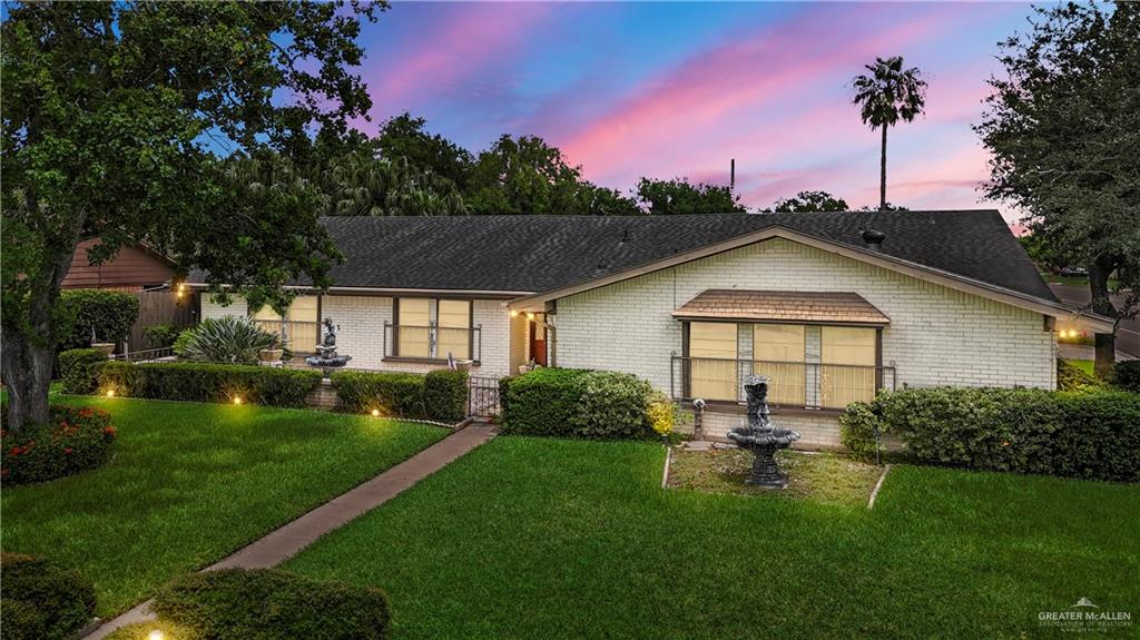 Ranch-style house with a yard