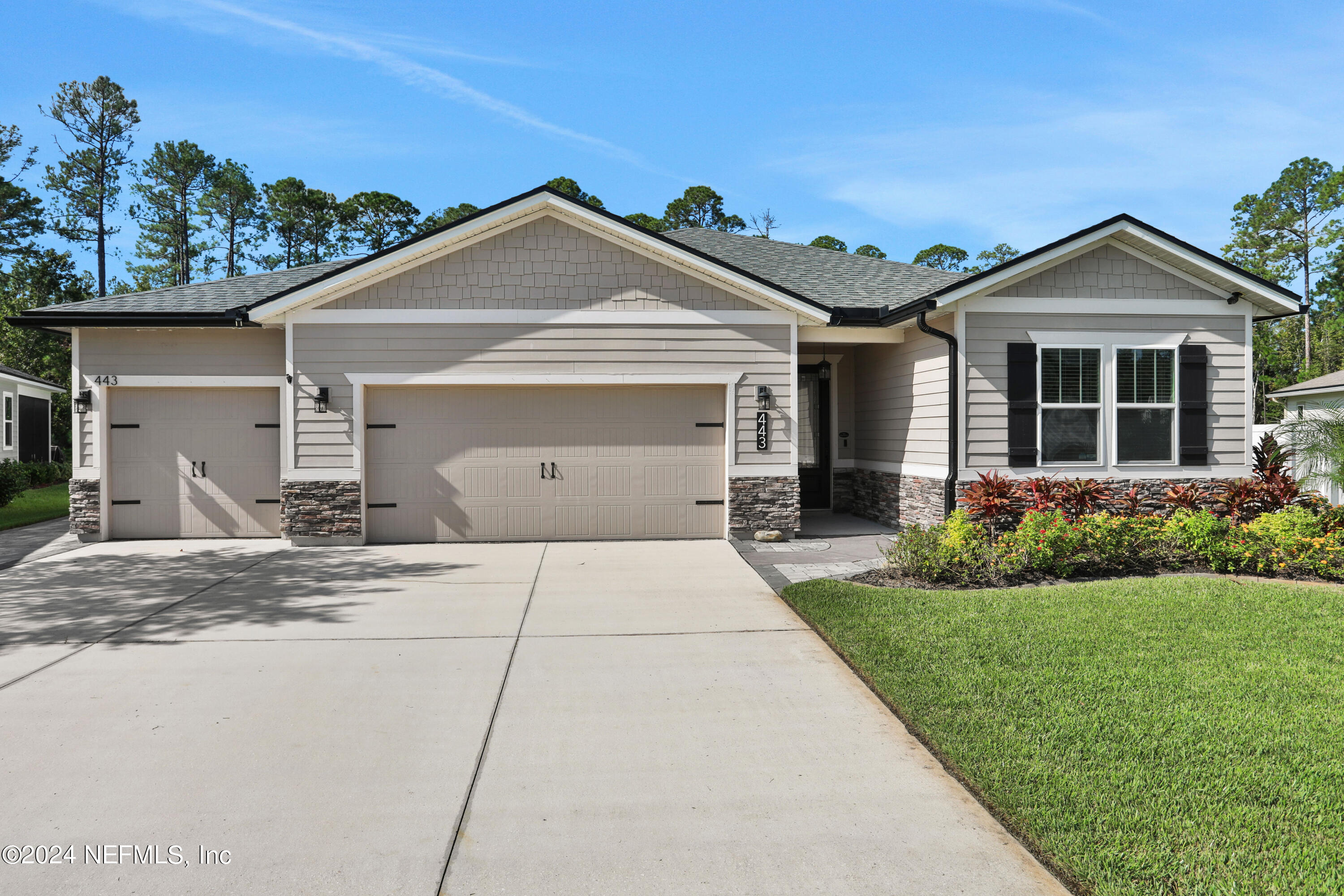 front view of a house with a yard