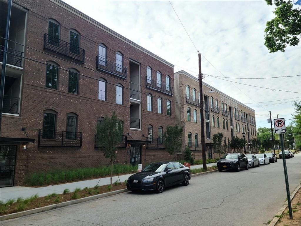 a car parked in front of a brick building