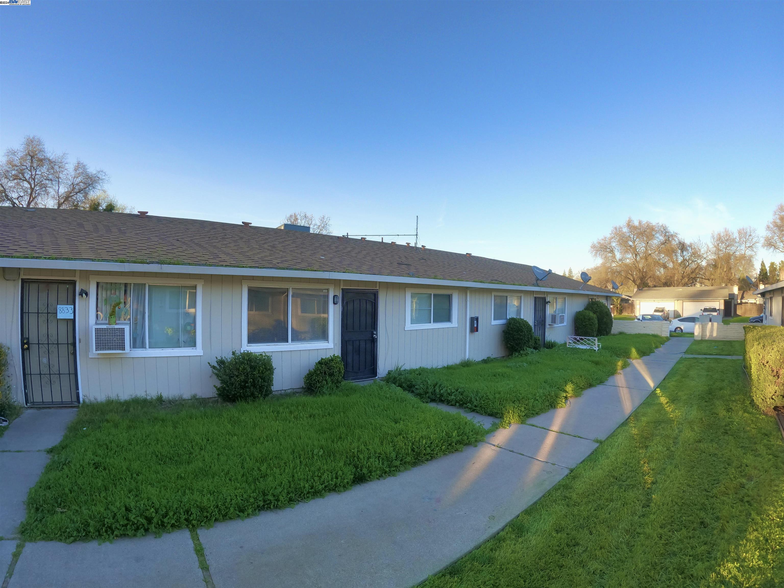 a view of a yard in front of a house