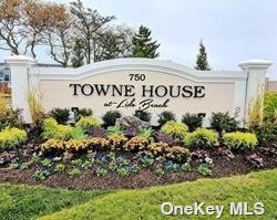 a sign broad in front of red brick house