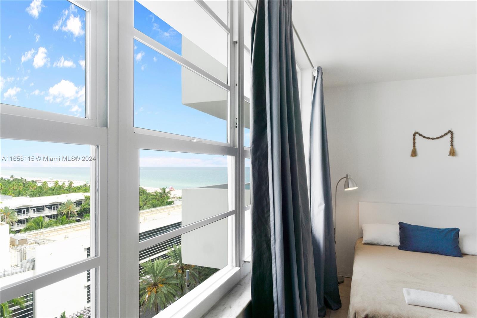 a view of a living room and a floor to ceiling window