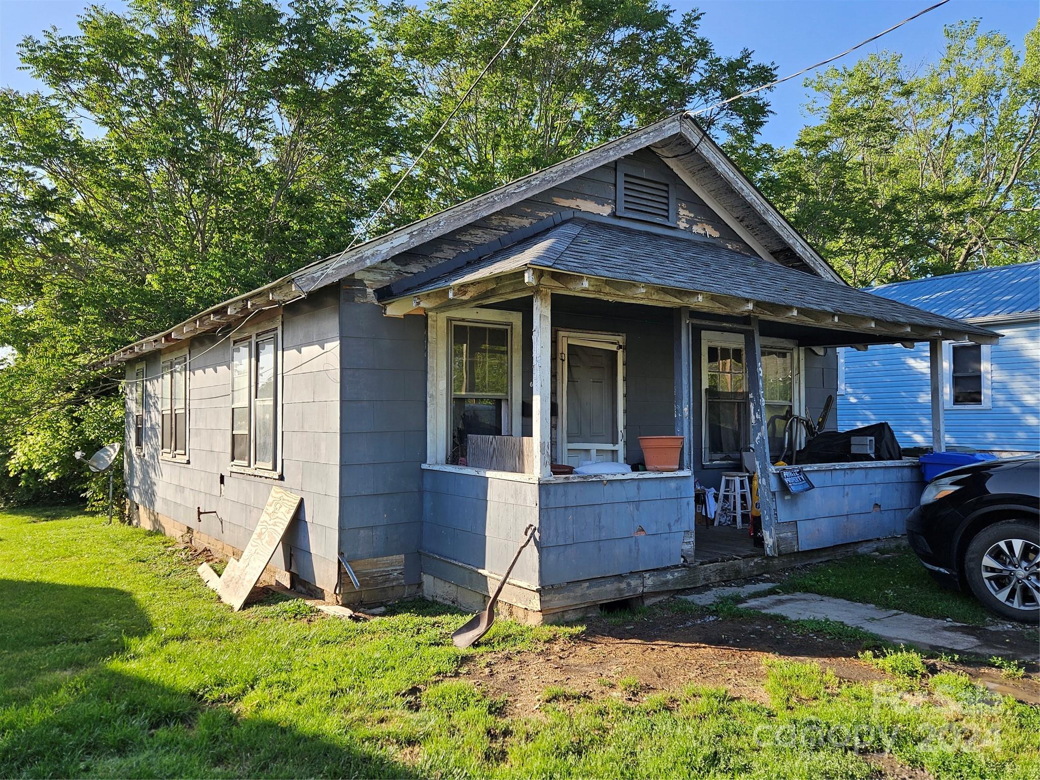 a front view of a house with a yard and porch