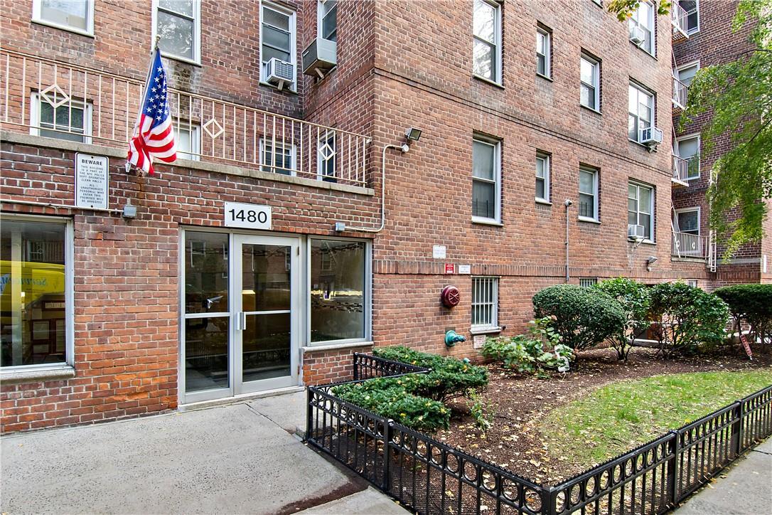 a front view of a building with garden