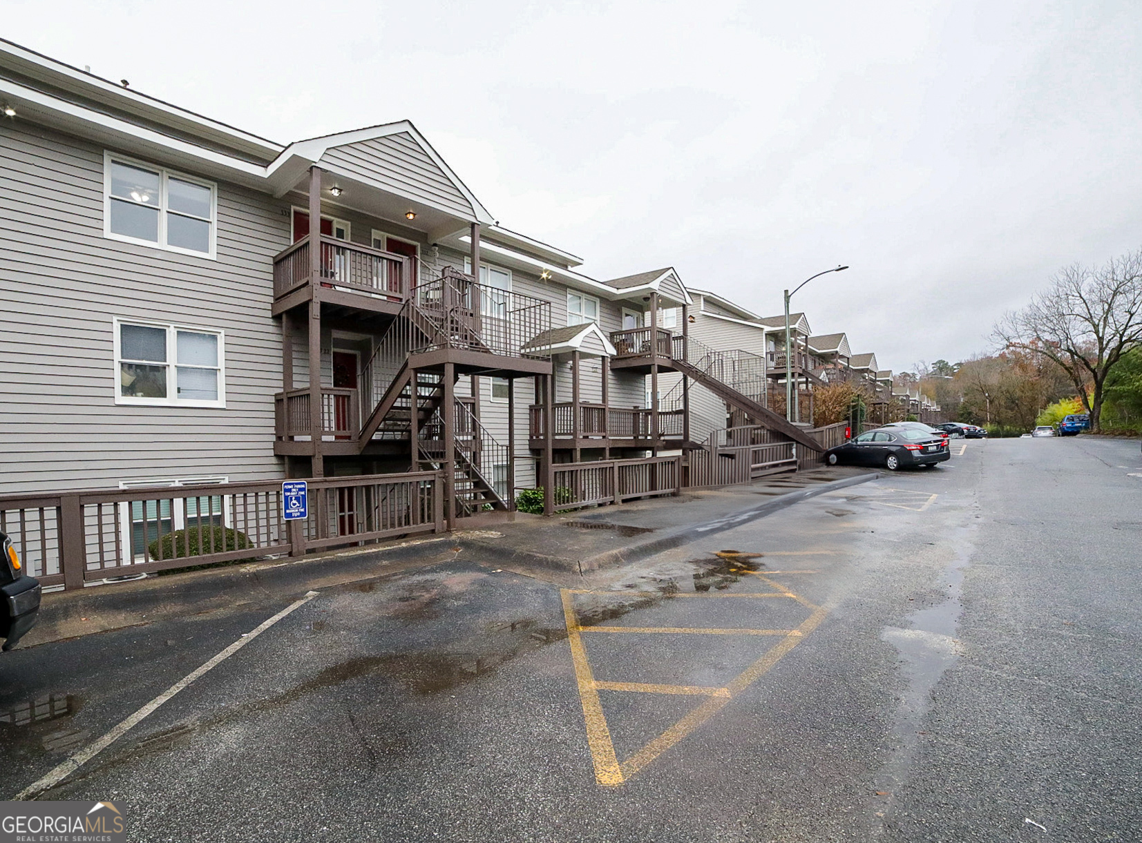 a view of a car park in front of house