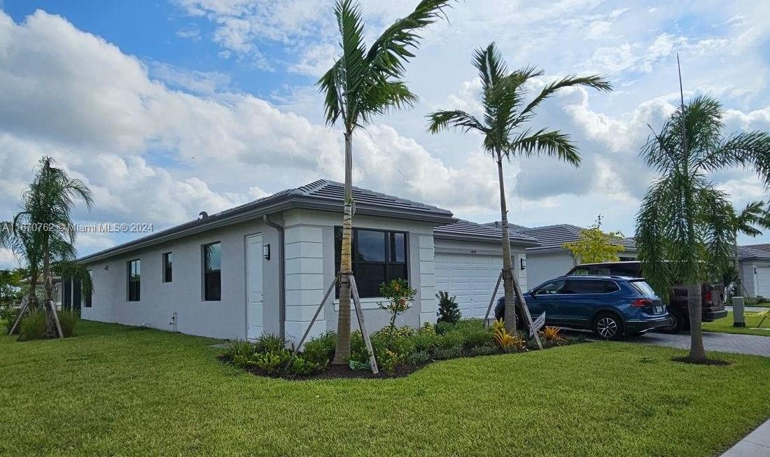 a front view of a house with garden