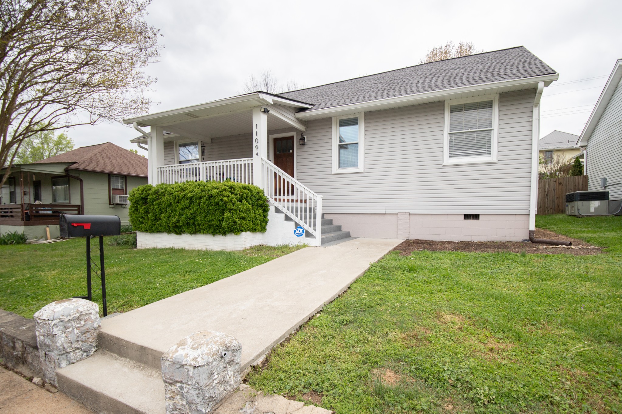 a front view of house with yard and green space